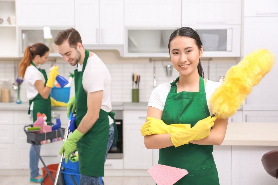 Professional Cleaners Cleaning the Kitchen